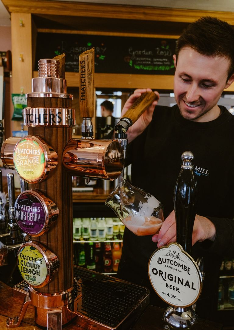 Man pulling buncombe pint at The Mill at Rode Bar on Thursday Quiz Night